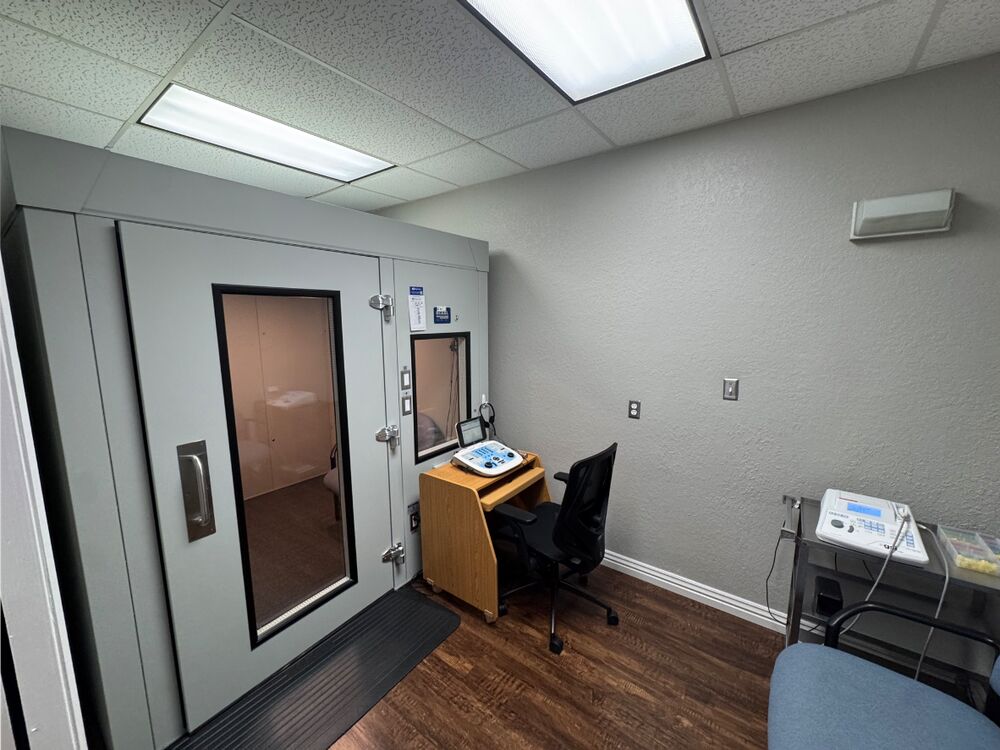 Sound-treated audiometric booth for hearing tests at Comprehensive Hearing Solutions in Pittsburg, KS