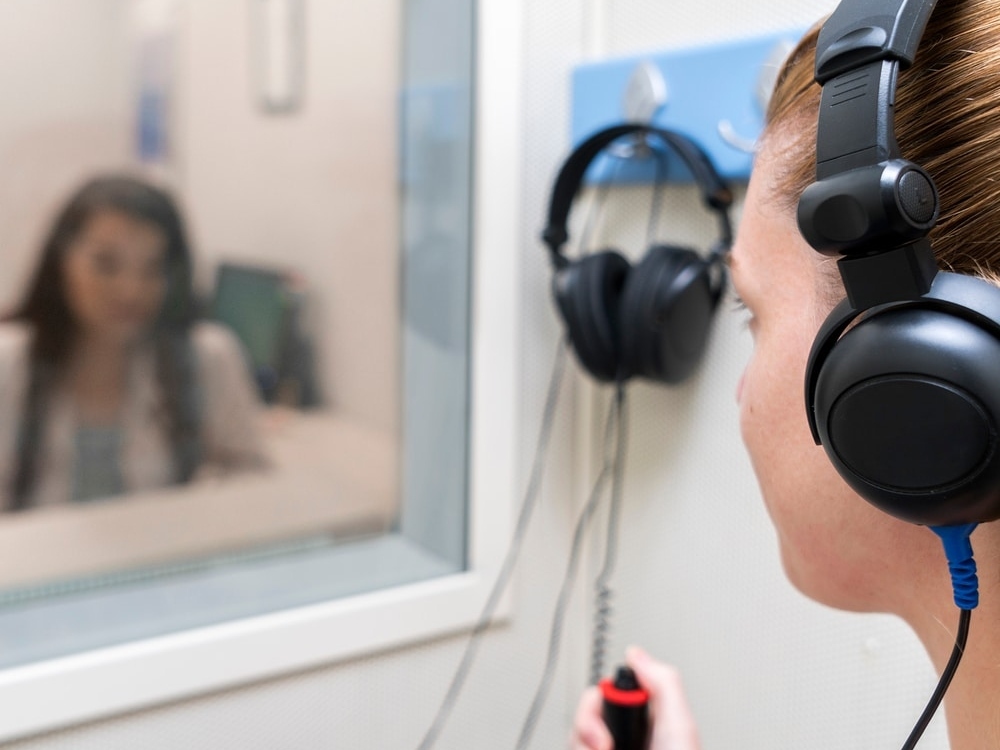 Doctor of Audiology conducting a hearing evaluation with an adult patient at Comprehensive Hearing Solutions in Pittsburg, KS