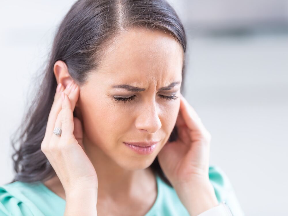 Patient talking with an audiologist about ringing in the ears at Comprehensive Hearing Solutions in Pittsburg, KS